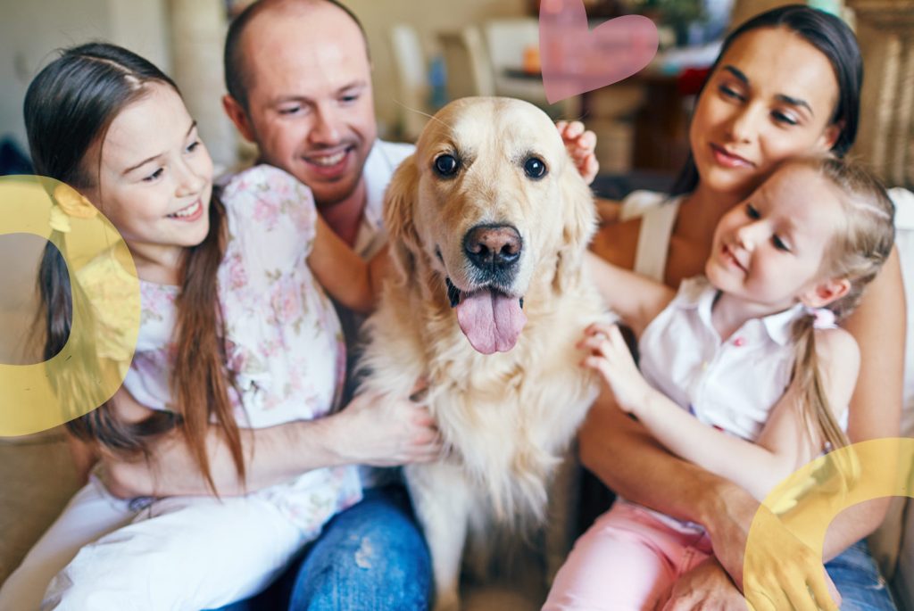 happy foster family with the family dog