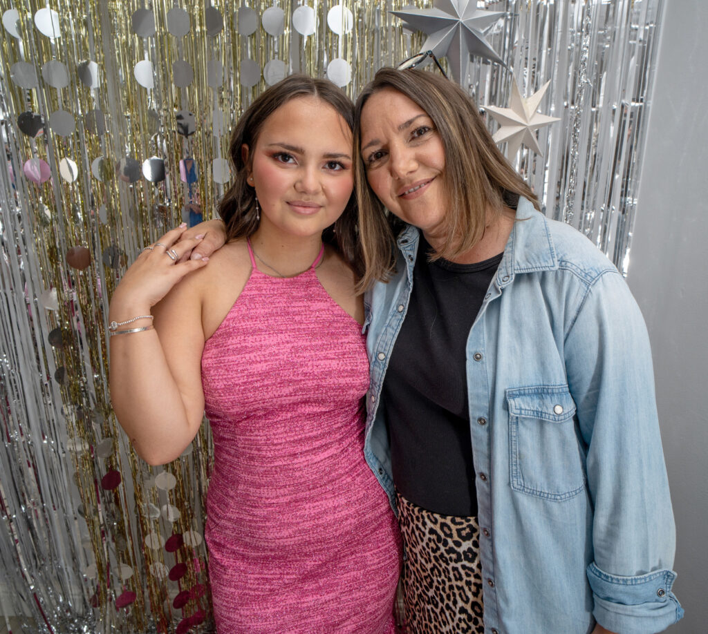 A teenage girl and her foster carer before heading to her school prom